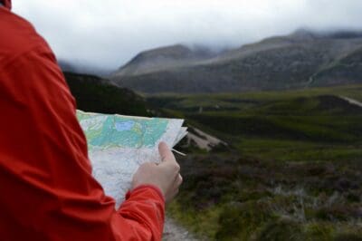 A hiker verifies their route before setting off